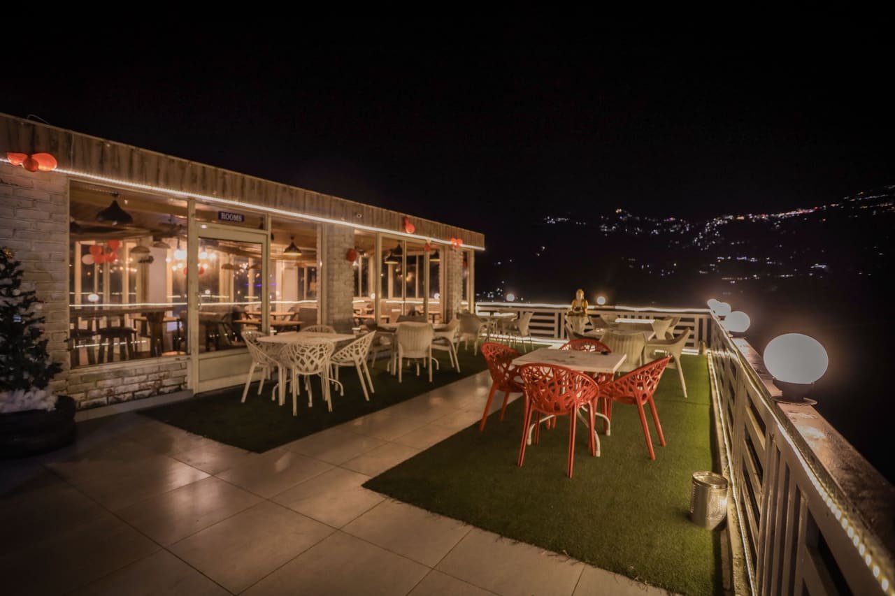 Night view across the rooftop seating