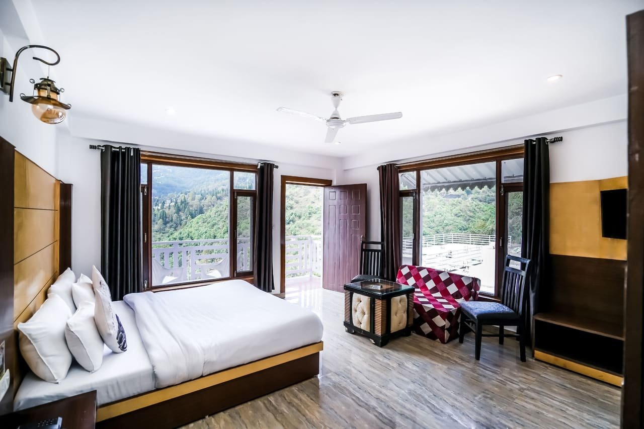 Corner room with seating and twin windows