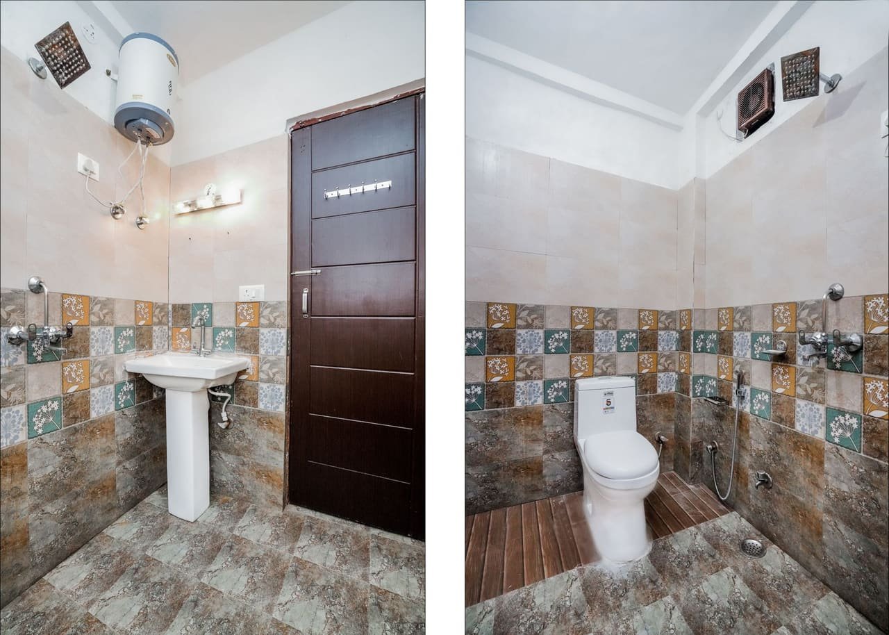 Attached bathroom with tiled walls