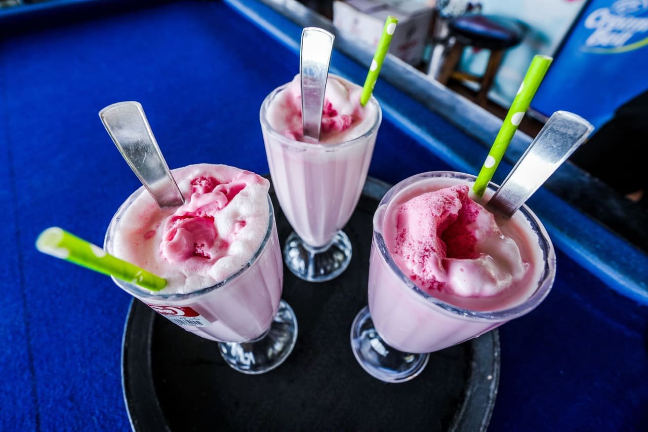 Strawberry milkshakes served tall