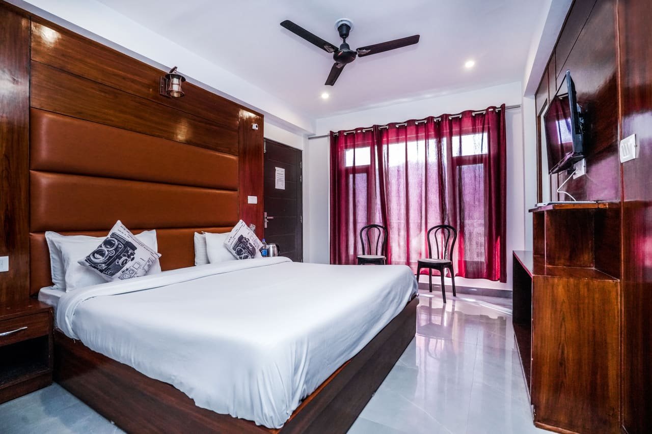 Room with balcony access and warm curtains