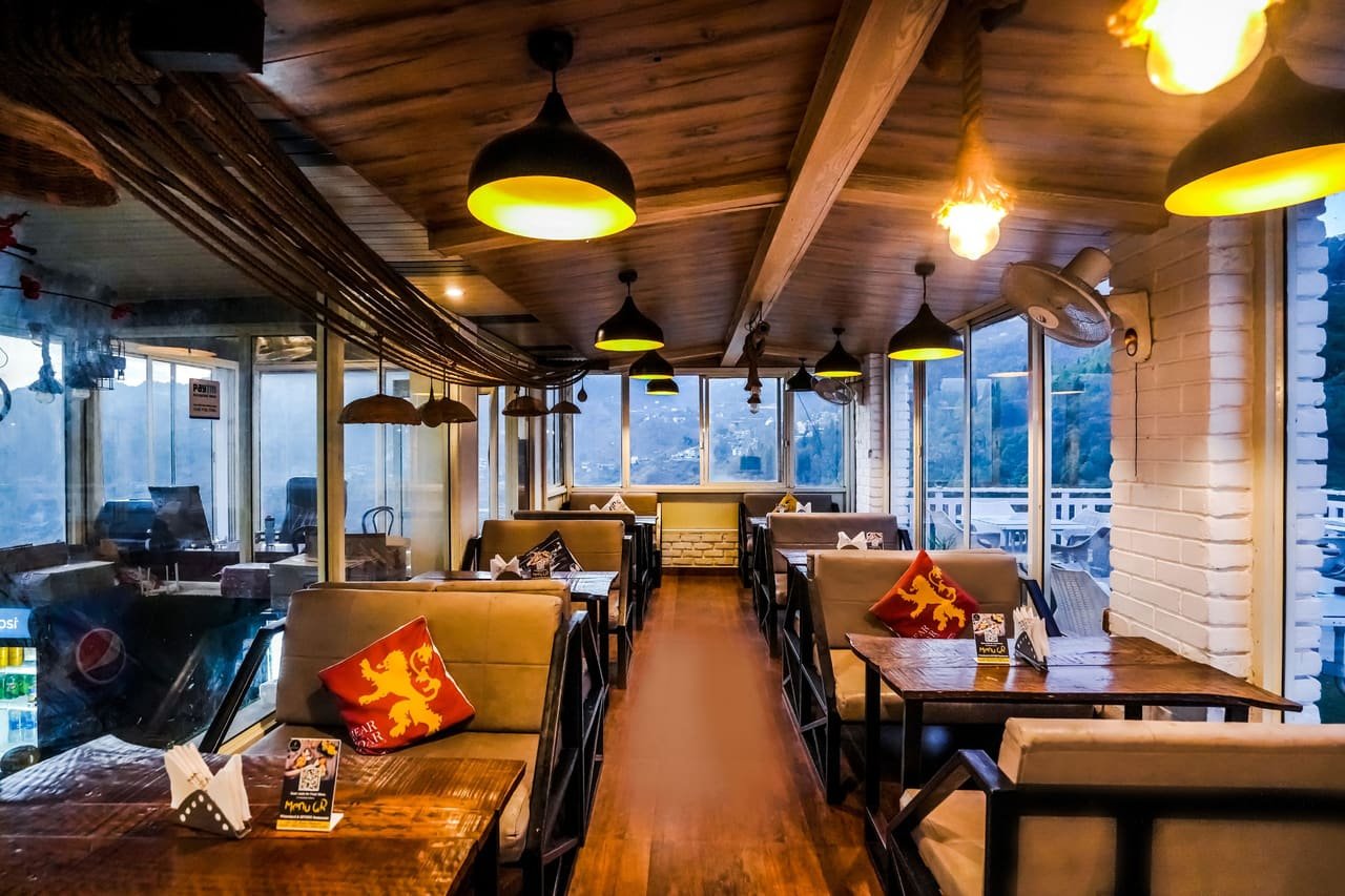 Booth seating in the wood-lined dining hall