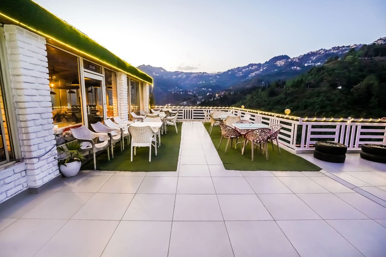 Open-air rooftop seating at dusk